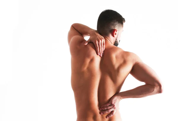 Joven sosteniendo su cuello con dolor. Concepto médico — Foto de Stock