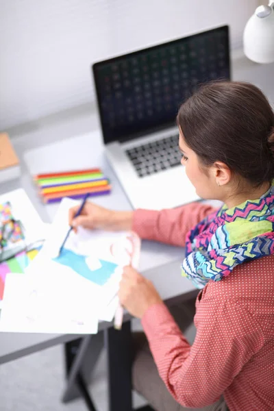 Creative young woman working in office with graphic tablet — Stock Photo, Image