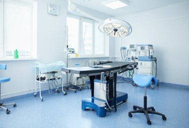 Interior of operating room in modern clinic clipart