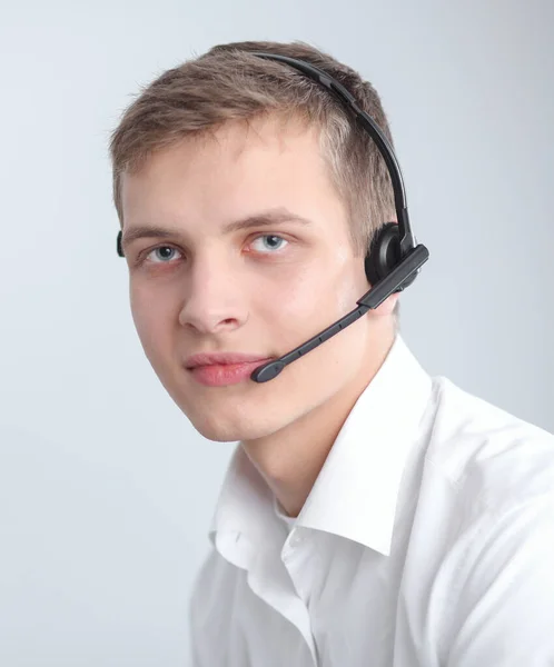 Portrait of young man smiling sitting on gray background. Portrait of young man — Stock Photo, Image