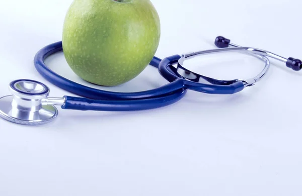 Medical stethoscope and apple isolated on white background — Stock Photo, Image