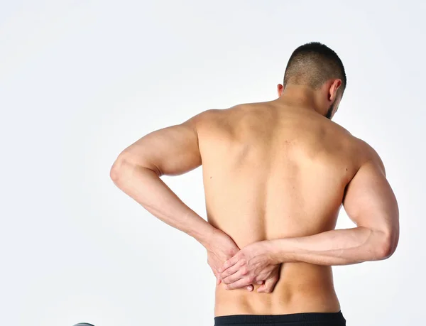 Joven sosteniendo su cuello con dolor. Concepto médico —  Fotos de Stock