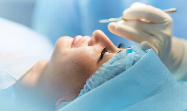 Man surgeon at work in operating room