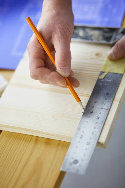 Architect working on drawing table in office — Stock Photo, Image