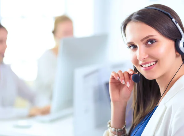 Business and technology concept - helpline operator with headphones in call centre — Stock Photo, Image