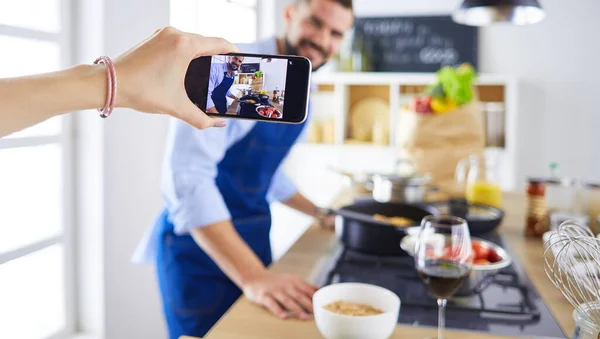 Portrait of handsome man filming cooking show or blog — Stock Photo, Image