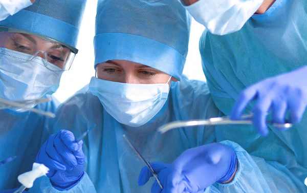 Below view of surgeons holding medical instruments in hands — Stock Photo, Image