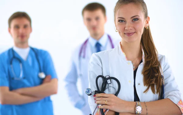 Attractive female doctor in front of medical group — Stock Photo, Image