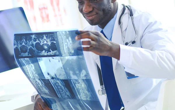 Portrait young african medical doctor holding patients x-ray — Stock Photo, Image