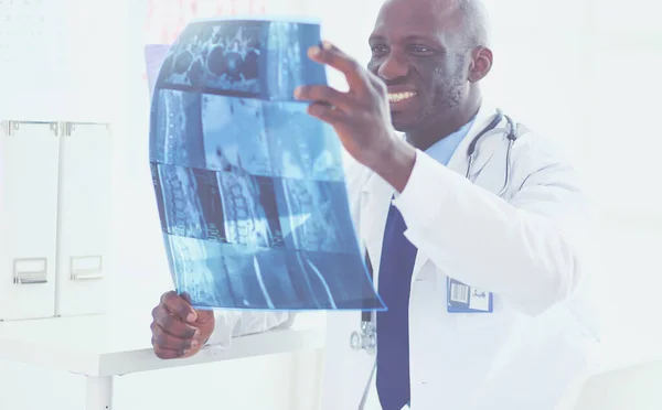 Portrait young african medical doctor holding patients x-ray — Stock Photo, Image