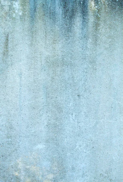 Old blue wall with damp, grungy background or texture