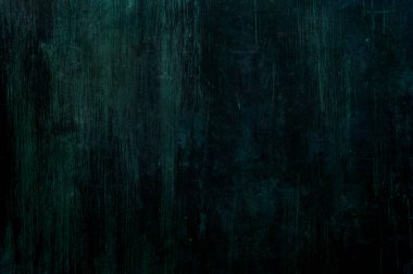 Koyu yeşil kazınmış duvar arkaplanı veya dokusu 