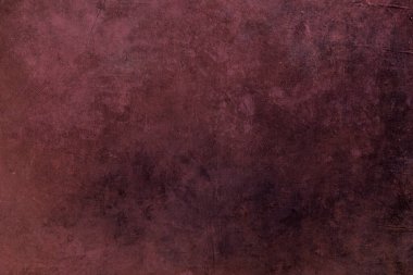 Koyu kırmızı arkaplanda altın lekeler var. 