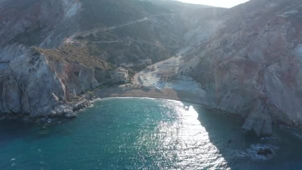 Wide Aerial Establishing Dolly Flight into Tropical Paradise Bay with Turquoise Water on Greek Island at Golden Hour — Vídeo de Stock