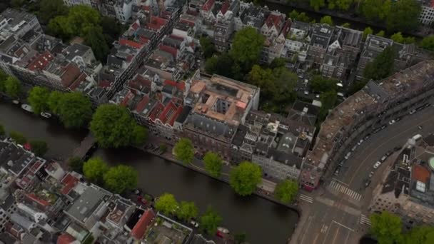 Birds Eye View of typical Amsterdam, Netherlands Neighbourhood with Canals and Bridges — Stock Video