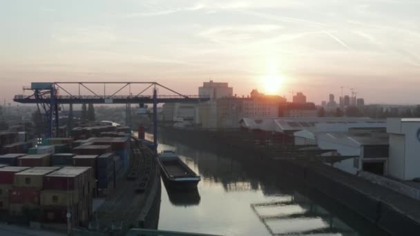 Port Warehouses and Cargo loading cranes in beautiful morning Sunlight, Aerial forward crane up slow — Stock video