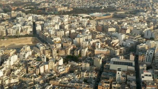 ( 영어 ) Beige Brown Apartment Blocks in Hot Area in Sunlight on Malta Island, Aerial Wide View Drone slide Perspective — 비디오