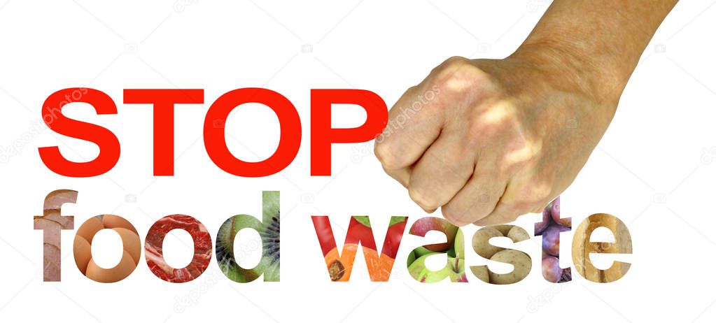 STOP food waste - female hand making a tense fist crushing the word WASTE of STOP FOOD WASTE isolated on a white background