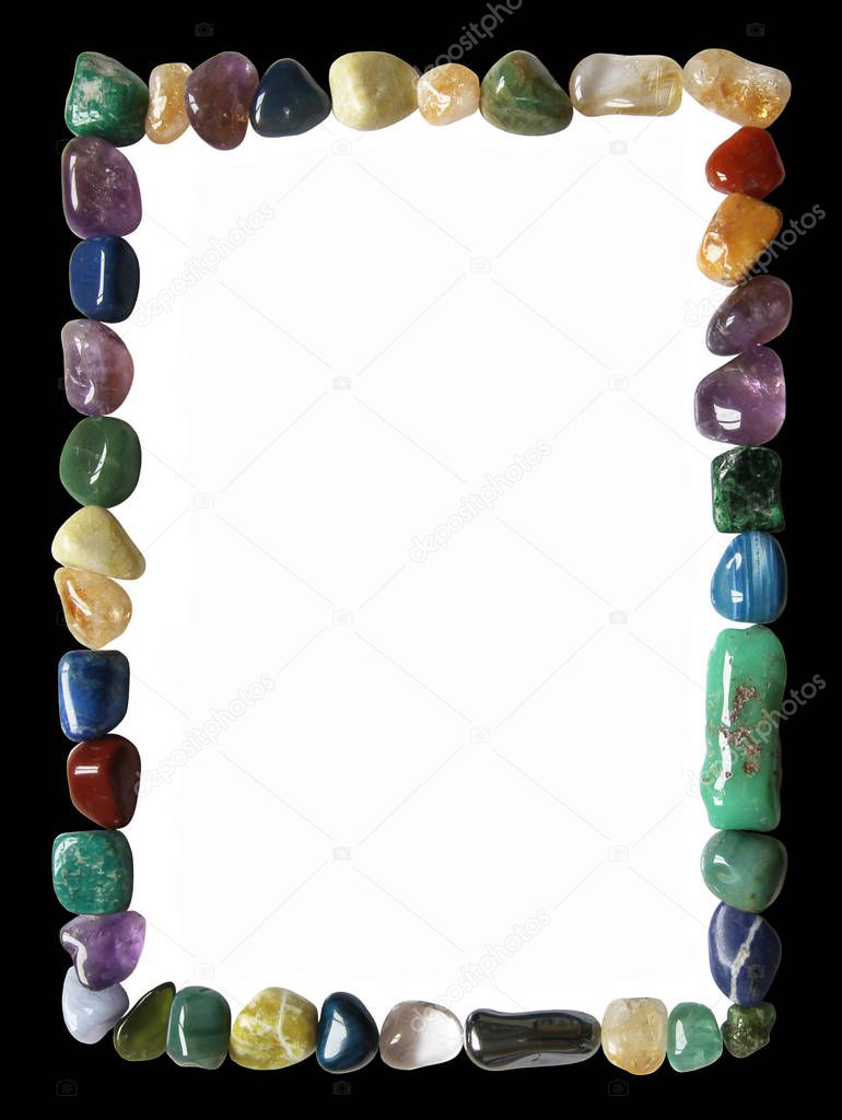 Crystal healing black and white rectangular frame - Multicoloured tumbled crystal healing stones placed in a neat portrait oriented rectangular formation border with black outside and white centre