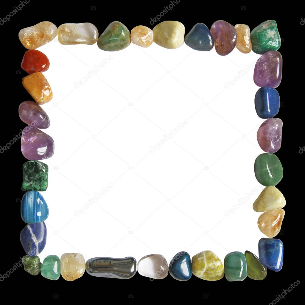 Crystal healing black and white frame - Multicoloured tumbled crystal healing stones placed in a neat square formation border with black outside and white centre