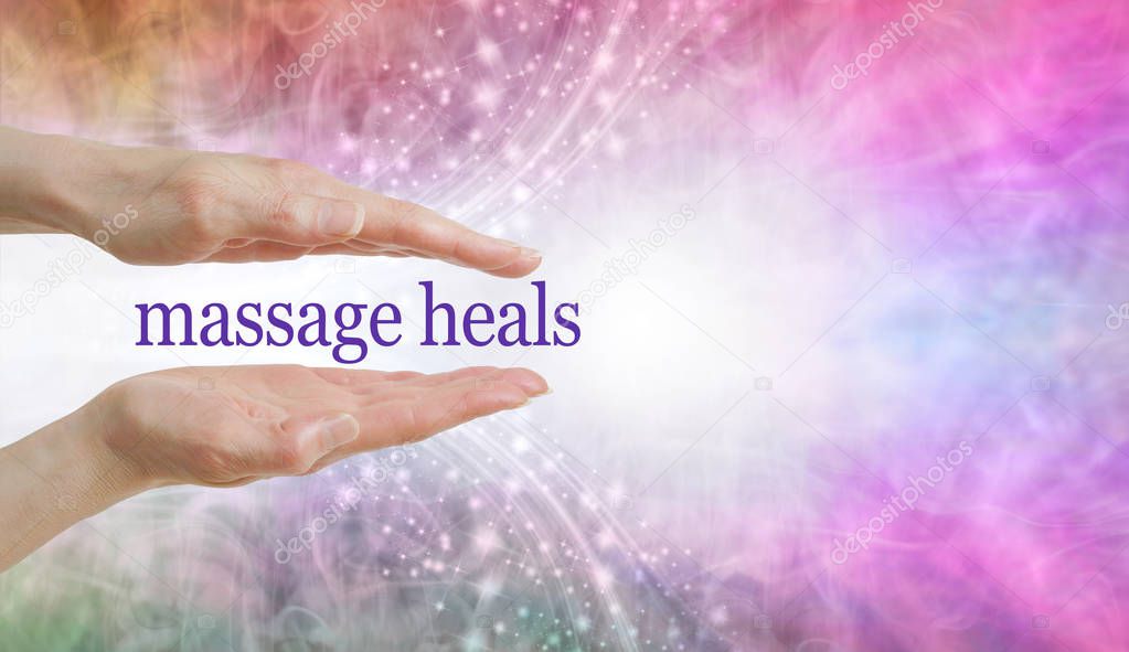 Massage REALLY DOES heal so give it a try - parallel hands with the words MASSAGE HEALS floating between against a beautiful pink blue glittery sparkling background and copy space