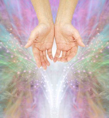 The humble hands of a Spiritual Healing Practitioner - female cupped hands against a multi coloured sparkle energy field background with copy space clipart