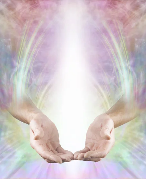 Spiritual Healer Message Board - male hands in open giving position with shaft of white light above on a multicoloured ethereal energy flowing background with copy space