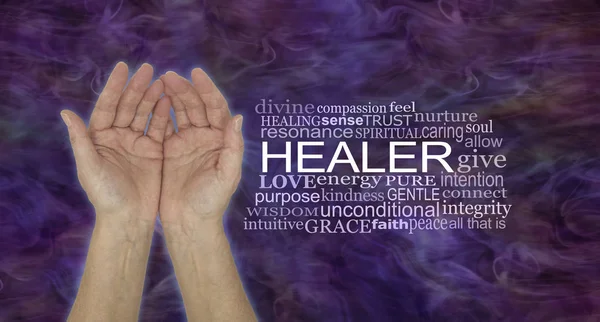 The Humble Hands of a Spiritual Healer - female cupped hands beside a HEALER word tag cloud against a dark purple red energy formation background