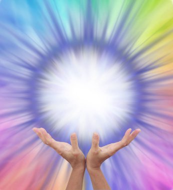Extraordinary Multicoloured Energy Field Formation - female cupped hands reaching up to a bright white orb surrounded by rainbow colours radiating outwards with copy space  clipart