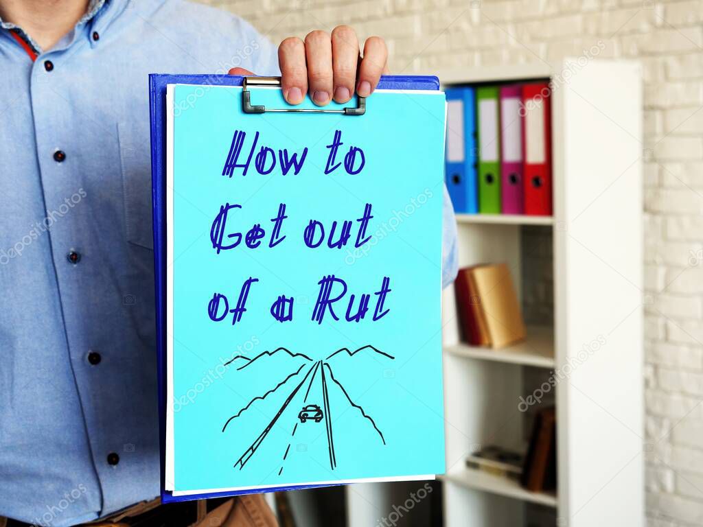 How to Get out of a Rut phrase on the piece of paper.