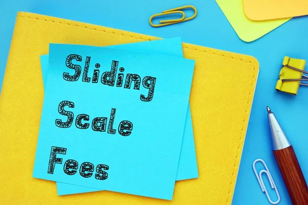 Business concept about Sliding Scale Fees with sign on the sheet.