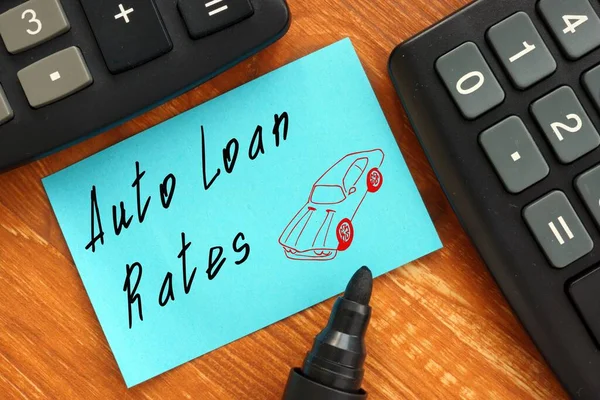 Business concept meaning Auto Loan Rates with sign on the piece of paper.