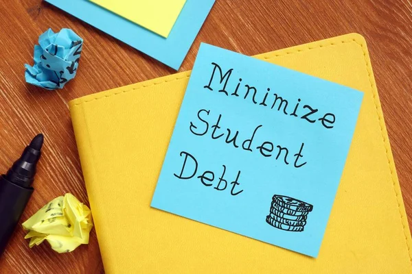 Financial concept meaning Minimize Student Debt with phrase on the page.