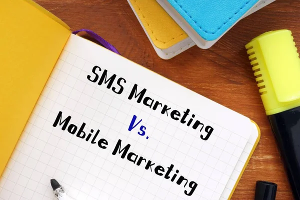 SMS Marketing Vs. Mobile Marketing inscription on the sheet.