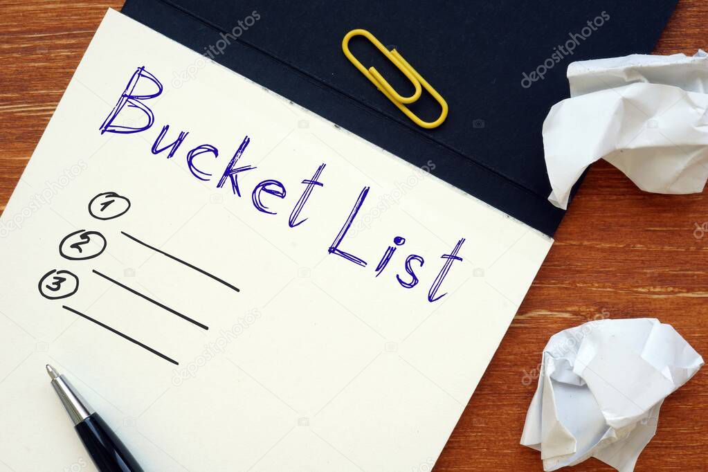 Financial concept meaning Bucket List with phrase on the piece of paper.