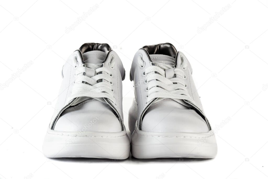 Women's red shoes from a varnish on a white background