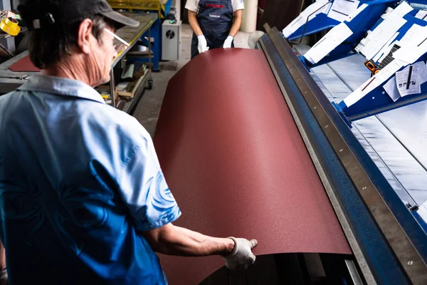 Worker at factory measures works metal production industrial