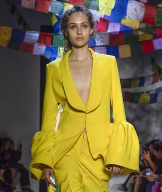 NEW YORK, NY - September 09, 2018: Michelle Gutknecht walks the runway at the Prabal Gurung Spring Summer 2019 fashion show during New York Fashion Week clipart