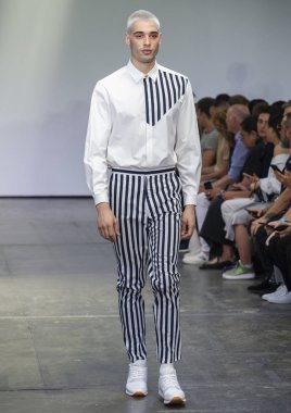 NEW YORK, NY - July 09, 2018: A model walks the runway at the Carlos Campos Show during New York Fashion Week Men's Spring 2019 clipart