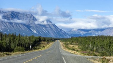 A view of the Alaska Highway in Canada between Whitehorse and Haines Junction clipart