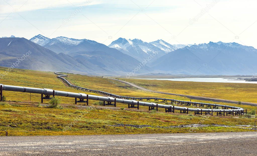 A view of the Brooks Range and the Trans-Alaska Pipeline from the Dalton Highway in Alaska, USA