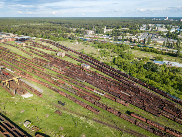 Freight trains on the railroad at the depot. Aerial view.