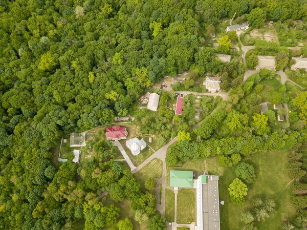 Aerial drone view. Buildings in the forest in Kiev.