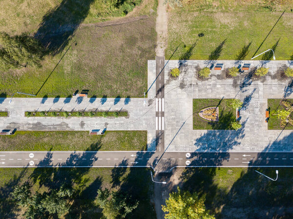 Aerial drone view. Cycling and walking path in the city park
