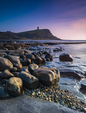 Kimmeridge çıkıntıları Dorset'deki / daki gün batımında
