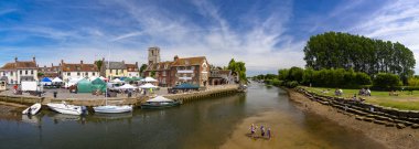 Children play in the river Frome at Wareham clipart