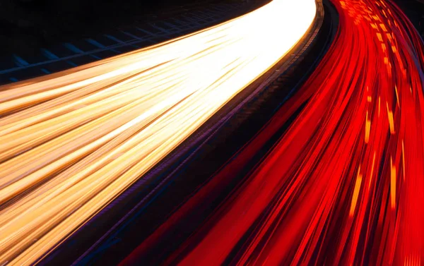 Light trails caused by multiple car headlights and tail lights — Stock Photo, Image