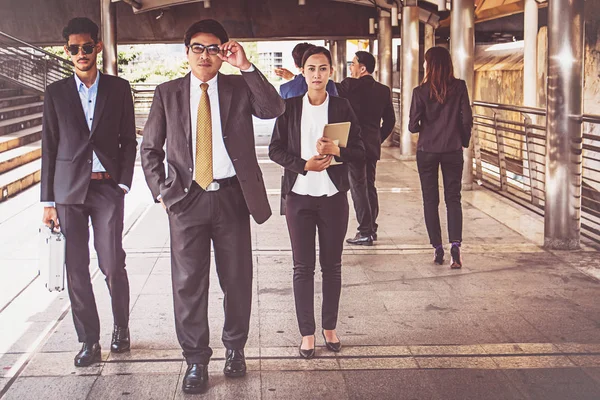 businesspeople group walking at city, business team