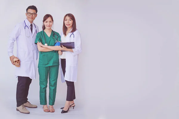 doctor and nurse checking patient information on a tablet device