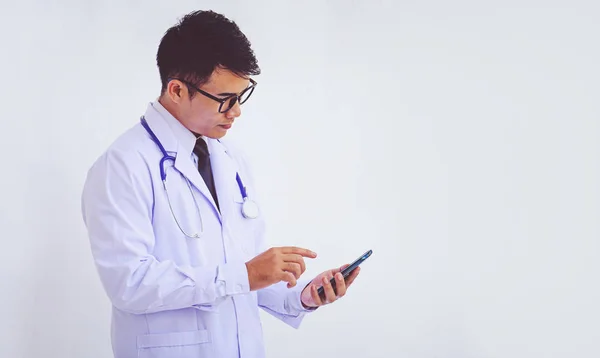 Young Doctor Man Wearing White Coat Using Smartphone — Stock Photo, Image